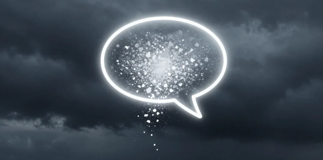 Abstract somber digital art of a glowing chat bubble dissolving into fragmented particles against a dark stormy digital sky in muted blue and gray tones